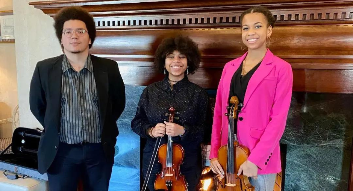 Penn Griffin Orchestra Director Damien Miles and violinists Bianca Jones and Brice Dale entertained guests at the March 13 luncheon.