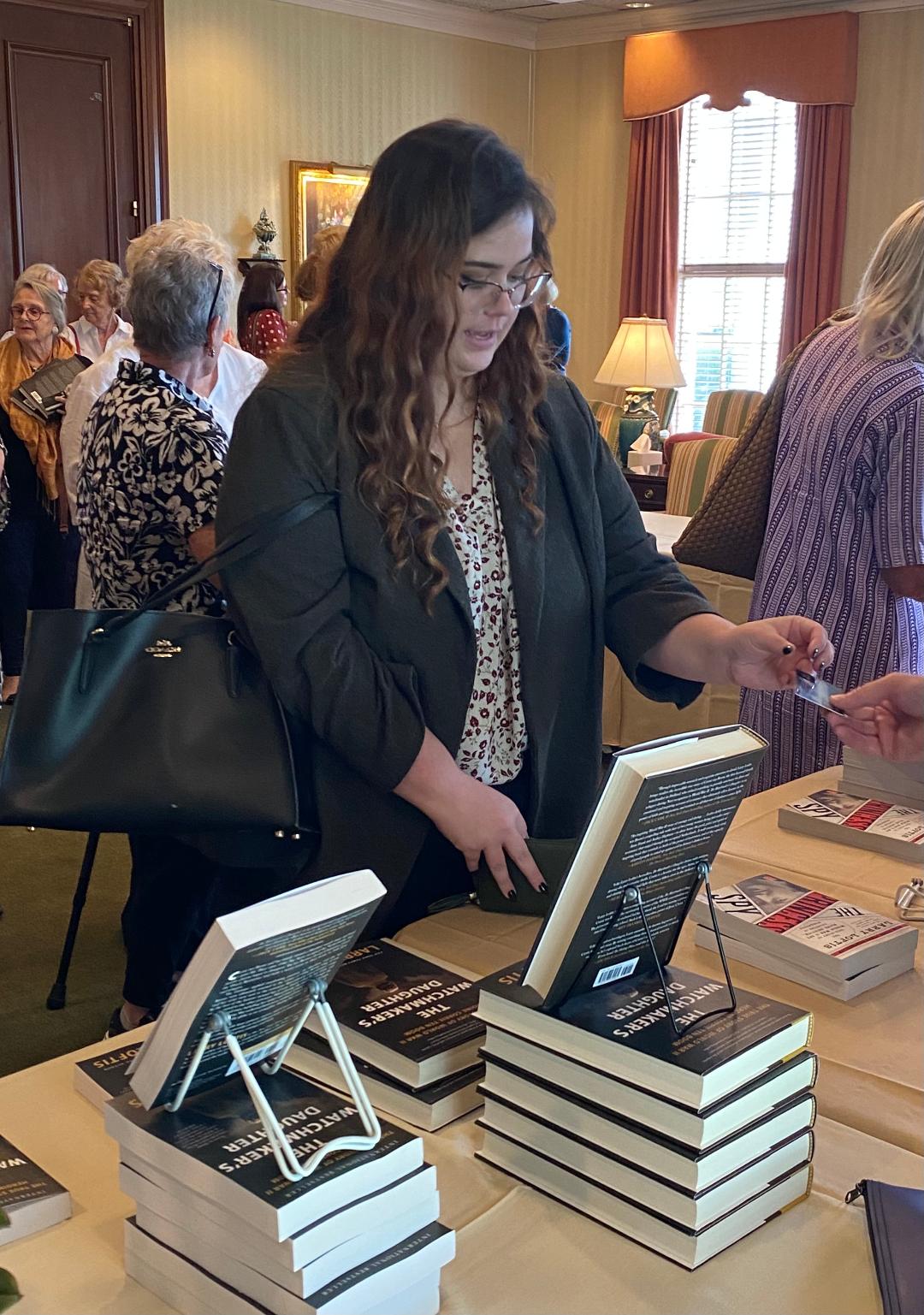 The book signing also gives members a chance to speak with the author.