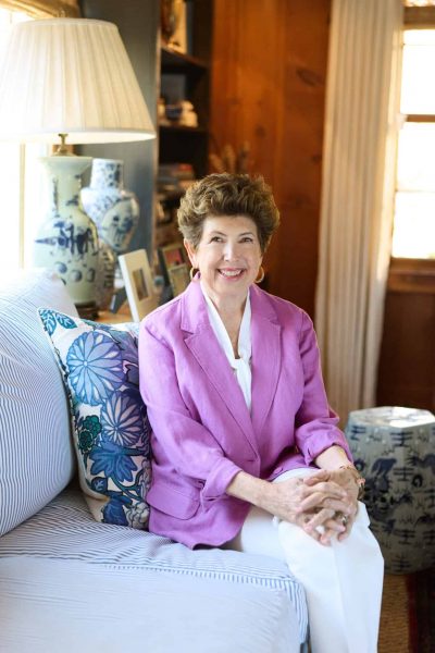 Mary Kay Andrews relaxing on a sofa